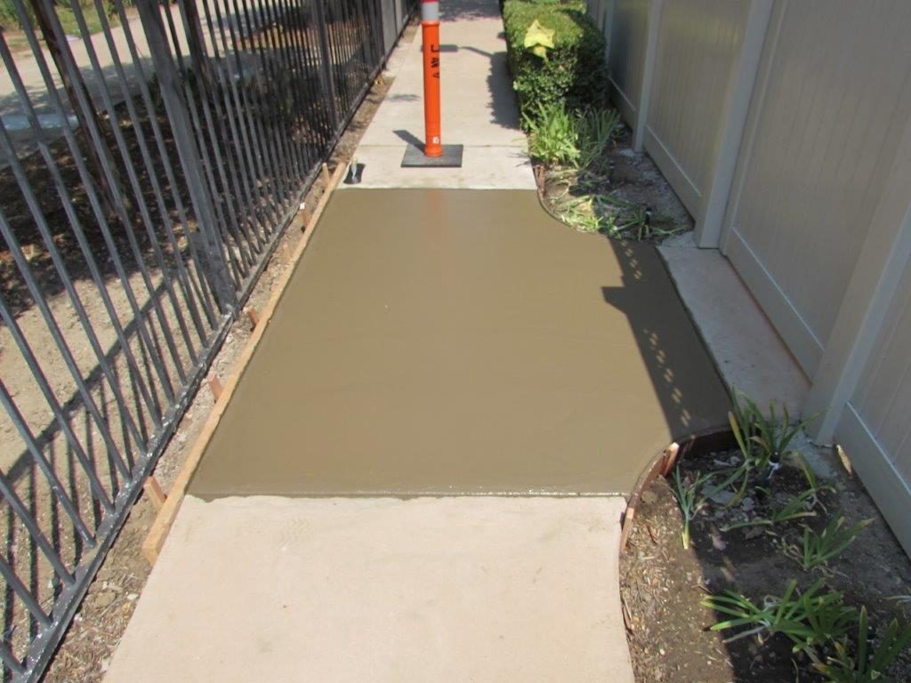 Concrete walkway beside a building